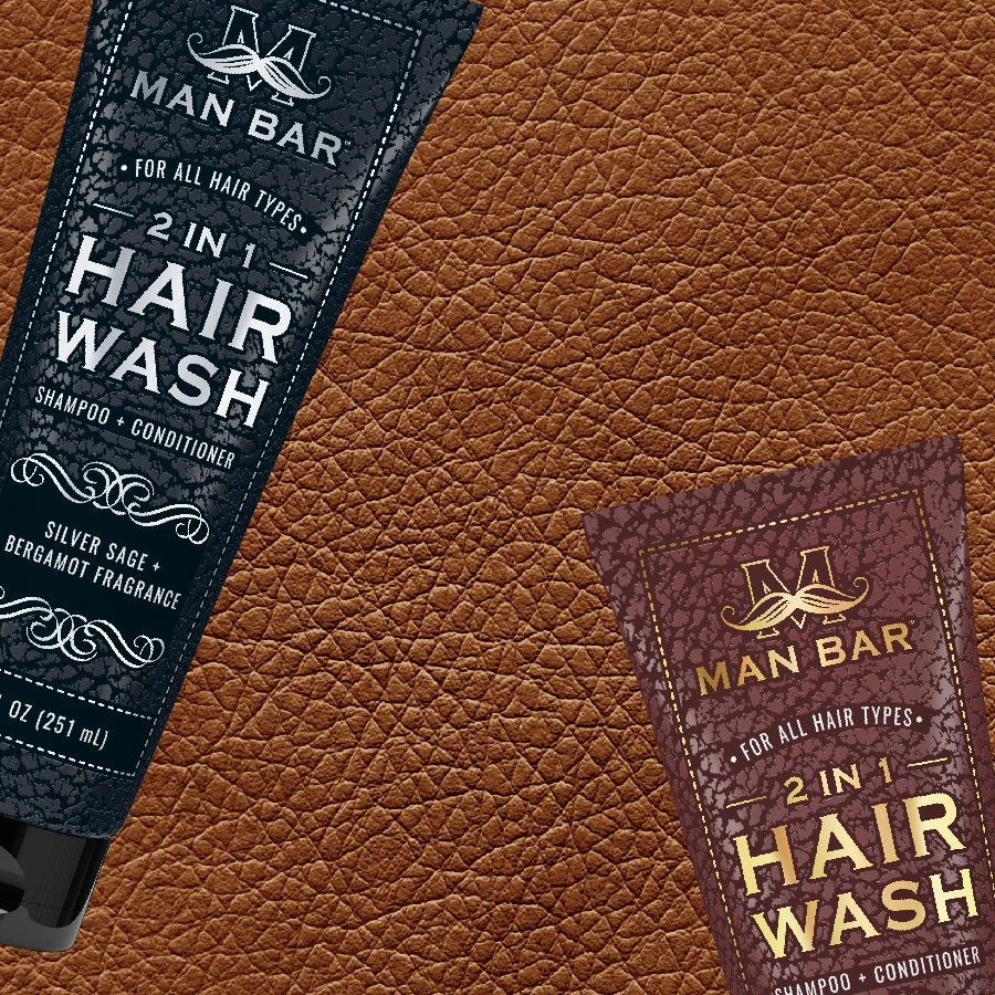 Man Bar 2-in-1 Hair Wash tubes on leather background
