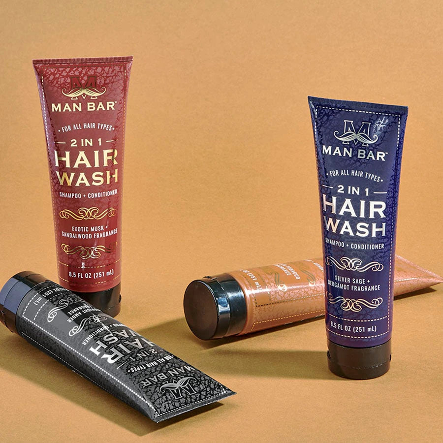 Man Bar 2-in-1 Hair Wash tubes on leather background